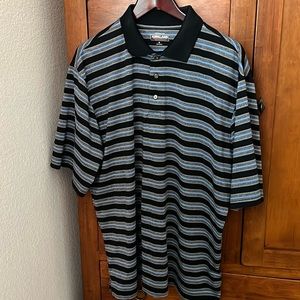 Men’s lightly used performance polo shirt by Kirkland.